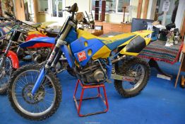 A 2001 Husaberg 600cc motocross motorcycle having a four-stroke, single cylinder,