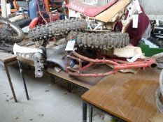 A KTM frame and parts including front forks, a mud guard, a fuel tank, a seat, wheels and tyres,