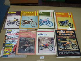 A box of motorcycle manuals including Honda CR250-500 Pro Link 1981-87,