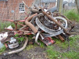 A quantity of scrap motorcycle parts, an Atco two-stroke mower engine (seized), chains, etc.