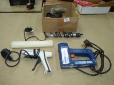 A box of electrical items including a 230 volt electric staple/nail gun, a glue gun with cartridges,
