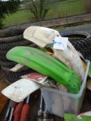 A box of plastic motorcycle mudguards.