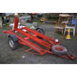 A motorcycle transporter trailer suitable for up to three machines and having a 50 mm diameter