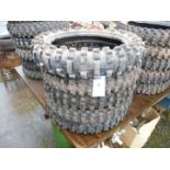 Five of 18'' diameter aggressive tread pattern motorcycle tyres.