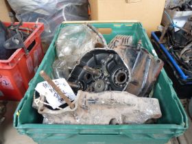 A box of mixed makes spares including a cylinder barrel, a cylinder head, a crankcase, gears etc.