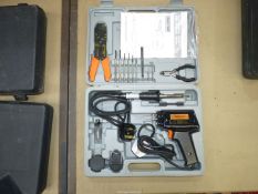 A Challenge cased soldering set including a pistol solderer and a small soldering iron, solder,