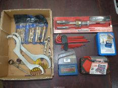 A quantity of tools including a cylinder bore honer/de-glazer, a ratchet and bit set,