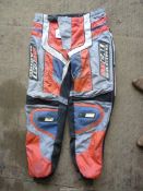 A pair of fabric competition protective trousers, 36'' waist approximately.