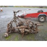 A Suzuki Quad Bike frame, parts and engine/gearbox unit (shaft drive). Engine does NOT turn.