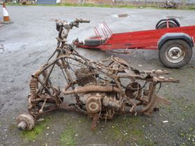 A Suzuki Quad Bike frame, parts and engine/gearbox unit (shaft drive). Engine does NOT turn.