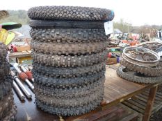 Ten of 21'' diameter motorcycle tyres, eight having aggressive tread pattern.