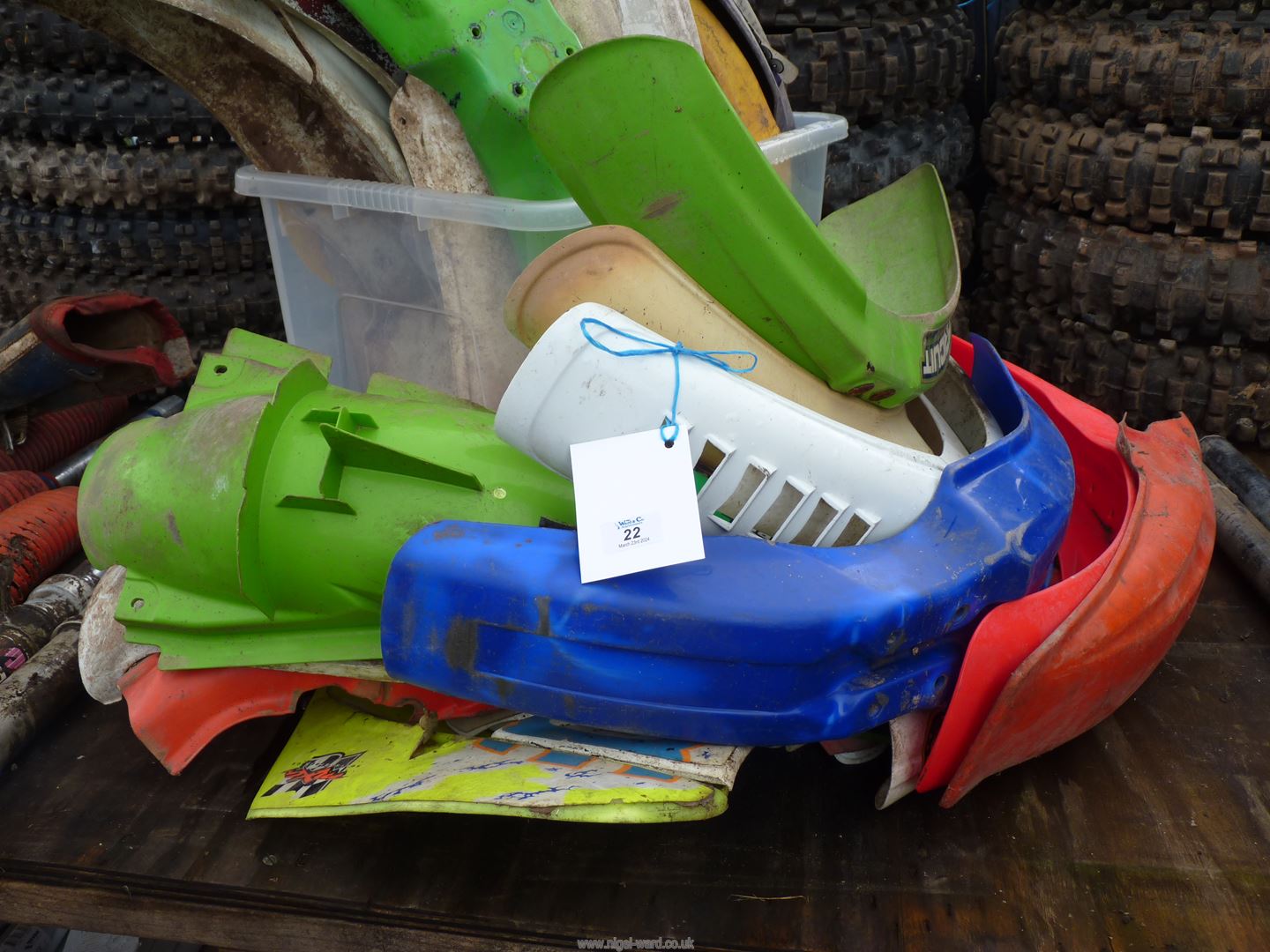 A quantity of motorcycle plastic mudguards and panels.