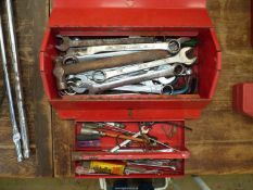 A red Kennedy toolbox with inner tray containing a large quantity of metric combination spanners,