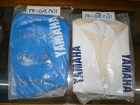 Two Yamaha seat covers :blue and white.