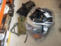 A helmet, goggles and other protective gear.