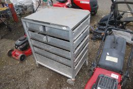 An aluminium Trolley with drawers and contents, on castors.