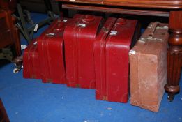 A set of four red Leather suitcases by 'Victor',