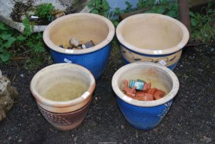 Four glazed Planters and a number of terracotta feet.