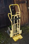 A yellow step-walker Sack Truck.