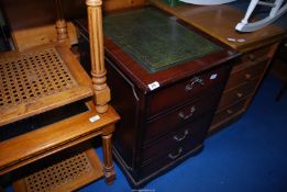 A two drawer filing cabinet with leather top (the front simulating four drawers) 28" deep x 21"