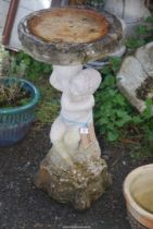 A cherub pillar Bird Bath, 29 1/2'' high x 15'' diameter.