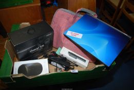 A box including; laptop, VR set, wireless charger, etc.