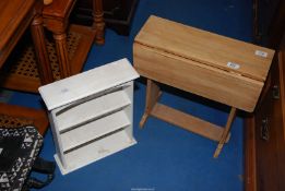 A small drop leaf table and a small display shelf unit.