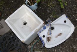 A Belfast sink and a hand basin.