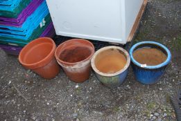 Two glazed planters and two terracotta pots.