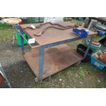 A large metal Workshop bench on castors with 4'' vice, 30'' x 37'' x 32'' high.