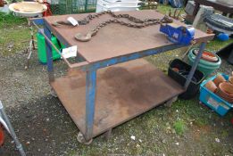 A large metal Workshop bench on castors with 4'' vice, 30'' x 37'' x 32'' high.