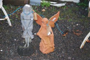 A terracotta figure of an Angel, 16'' high plus a figure of a lady, 21'' high.