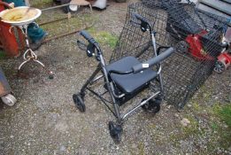 A four-wheeled Walking Aid with seat.