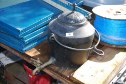 A fireside/sway-bar hanging Water Urn/kettle with tap.