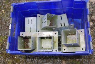 A tub of galvanised post supports.