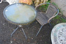 A circular glass topped table, 2' diameter x 28'' high and a single chair.