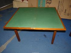 A Teak flap over Card table with baize top, standing on square tapering legs,