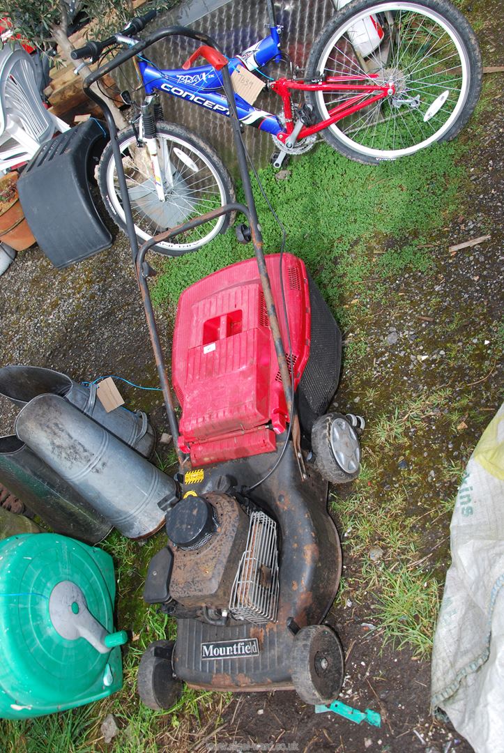 A Mountfield four stroke self-propelled Lawn Mower with grass box.