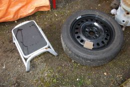 A caravan steps and a 5 stud wheel with tyre, 215/55 R17.