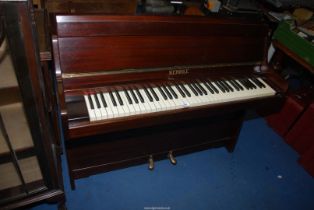 A Mahogany cased iron framed "Kemble" upright piano.