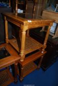 Two Mahogany occasional tables having bevelled glass tops and cane shelves, 22" wide x 22" high.