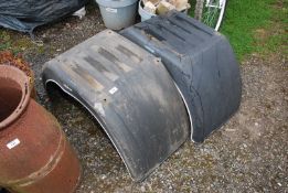 Two commercial plastic mud guards.
