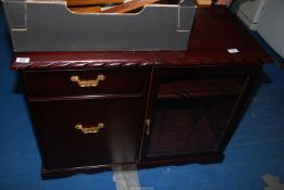 A 'J.E Coyle Ltd' mahogany finished music cabinet 36 1/2" x 18" x 27 1/2" high.