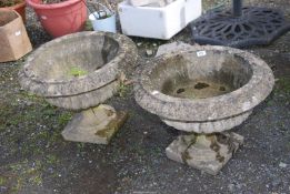 Two concrete planters, 22'' diameter x 16 1/2'' high.