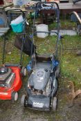 A MacAllister lawn mower with grass box, Briggs & Stratton 158 cc engine (good compression).