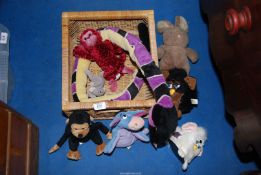 A wicker tray containing Furbies, cuddly toys, etc.