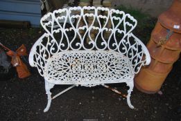 A cast iron two seater garden Bench, 37'' wide x 32'' high.