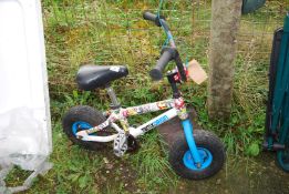 A "TBMX Origin" child's bicycle.