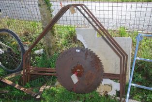 A circular saw blade, 23'' diameter plus three box-section sign frames.