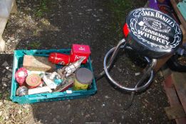 A bar stool, old tins, etc.